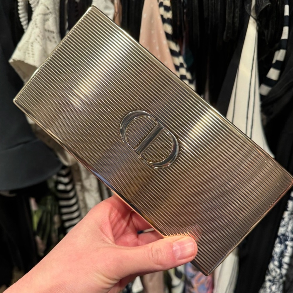 AUTHENTIC metallic clutch with 4 lipsticks, NWOT.